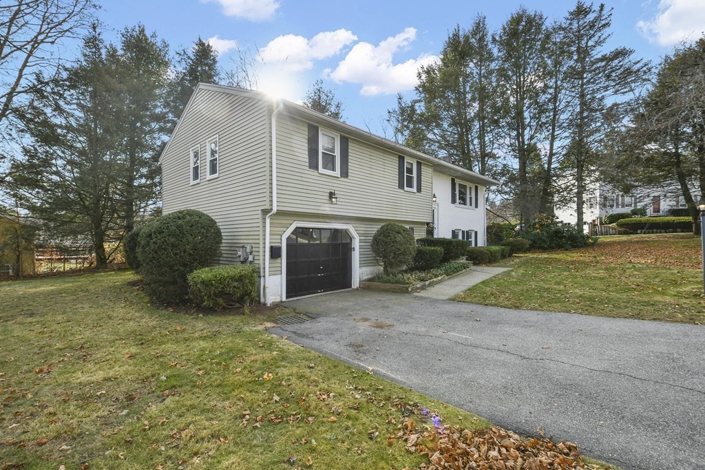 14 Oak Ridge Way Shrewsbury, MA 01545 - Photo 26 of 30 a view of a house with backyard and a trees