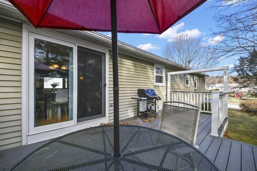 14 Oak Ridge Way Shrewsbury, MA 01545 - Photo 30 of 30 a porch with a table and chairs