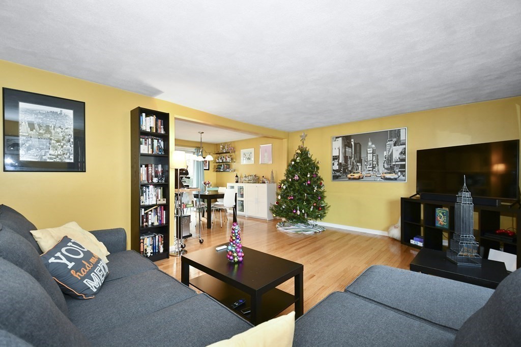 14 Oak Ridge Way Shrewsbury, MA 01545 - Photo 3 of 30 a living room with furniture and a flat screen tv