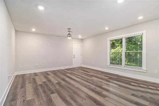 a view of an empty room with a window
