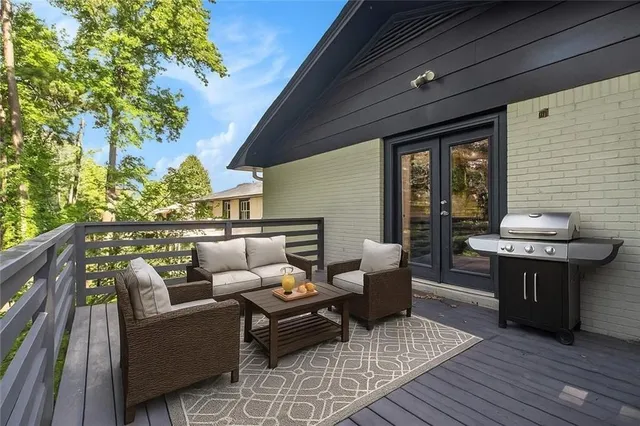 a balcony with furniture and wooden floor