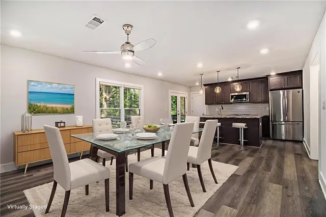 a view of a dining room with furniture window and wooden floor