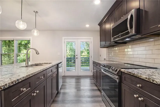 a kitchen with a stove and a sink