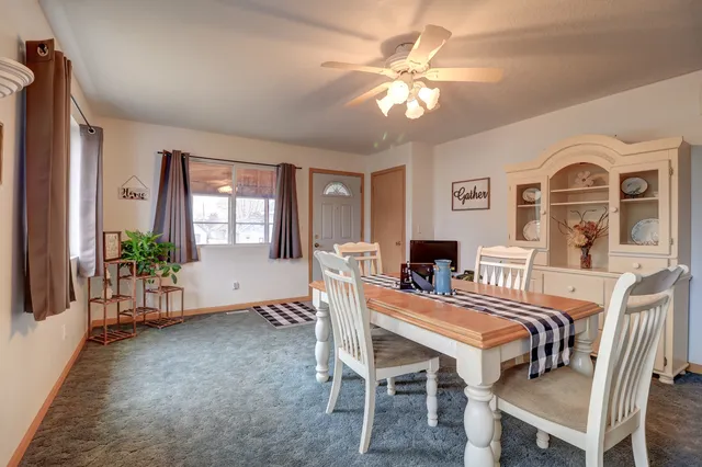 a dining room with furniture and window