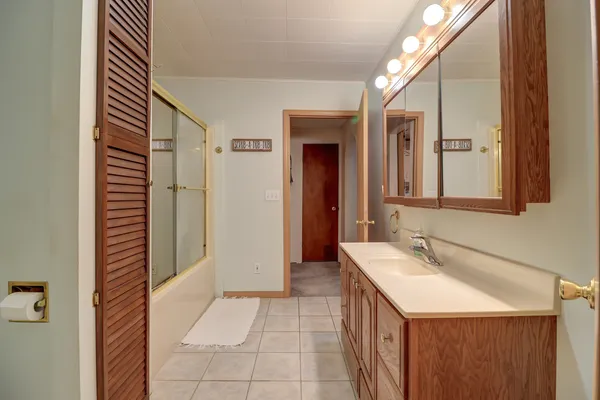 a bathroom with a sink and a mirror