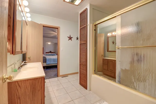 a bathroom with a tub and shower