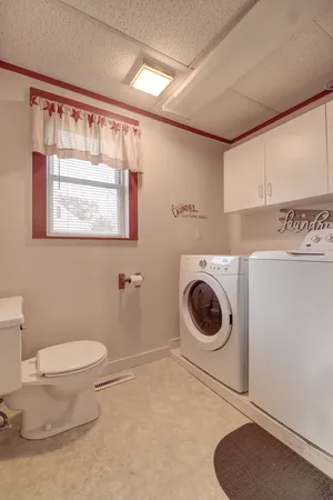 a bathroom with a toilet and a sink