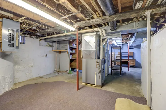a view of empty room with wooden ceiling