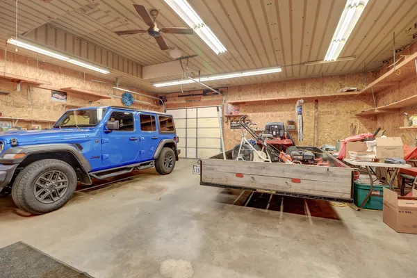 a house view with swimming pool in front of it