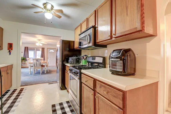 a kitchen with stainless steel appliances granite countertop a stove and a sink with cabinets