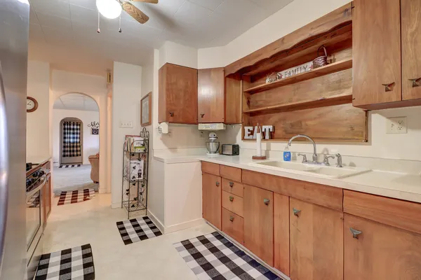 a kitchen with sink cabinets and window