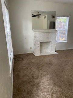 3366 South 7th Street Abilene, TX 79605 - Photo 3 of 16 a view of a livingroom with a fireplace