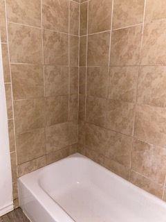 3366 South 7th Street Abilene, TX 79605 - Photo 10 of 16 a bathroom with a bathtub