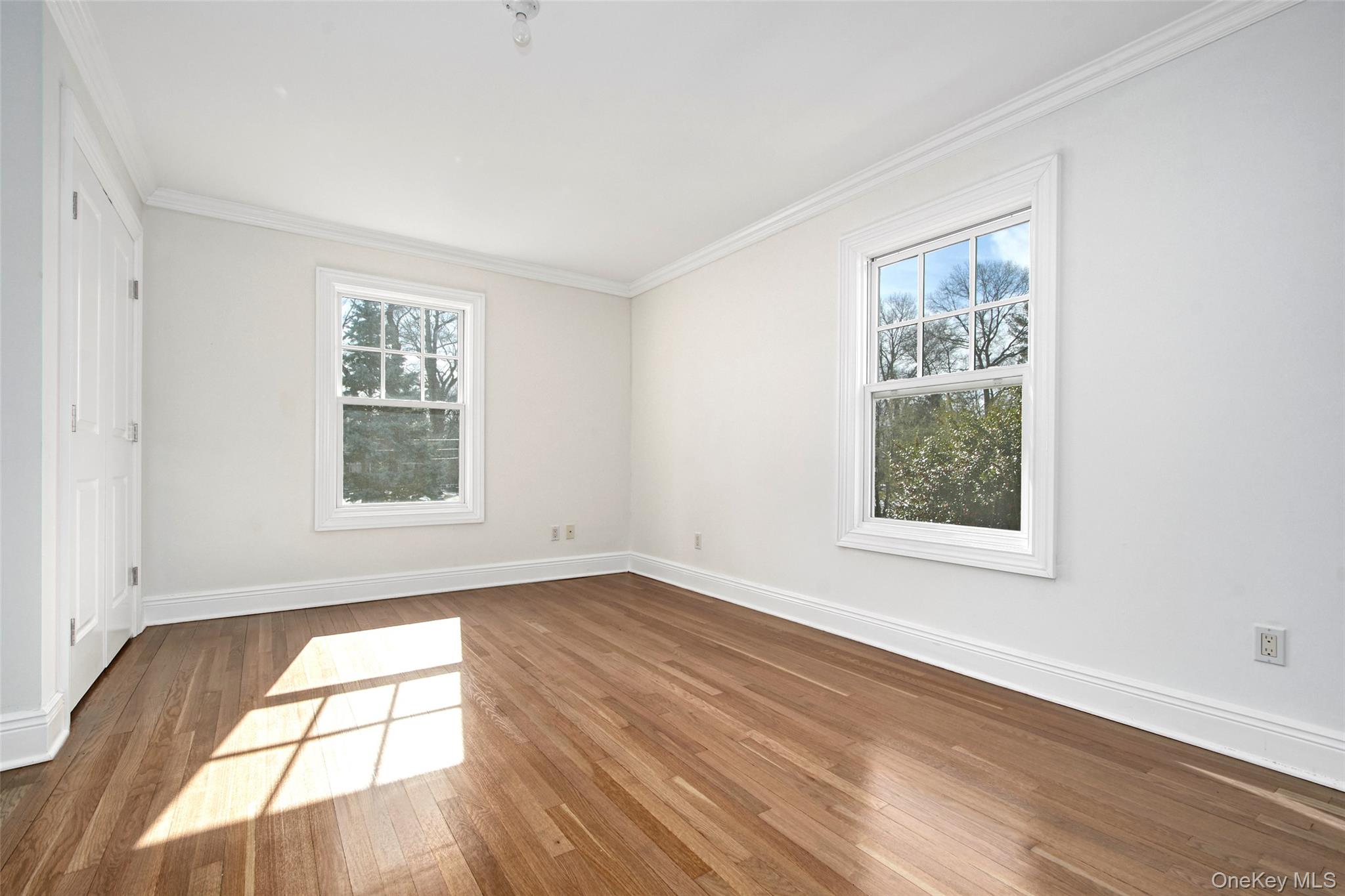 8 Walden Lane Rye, NY 10580 - Photo 13 of 28 Bedroom featuring ornamental molding, hardwood finished floors