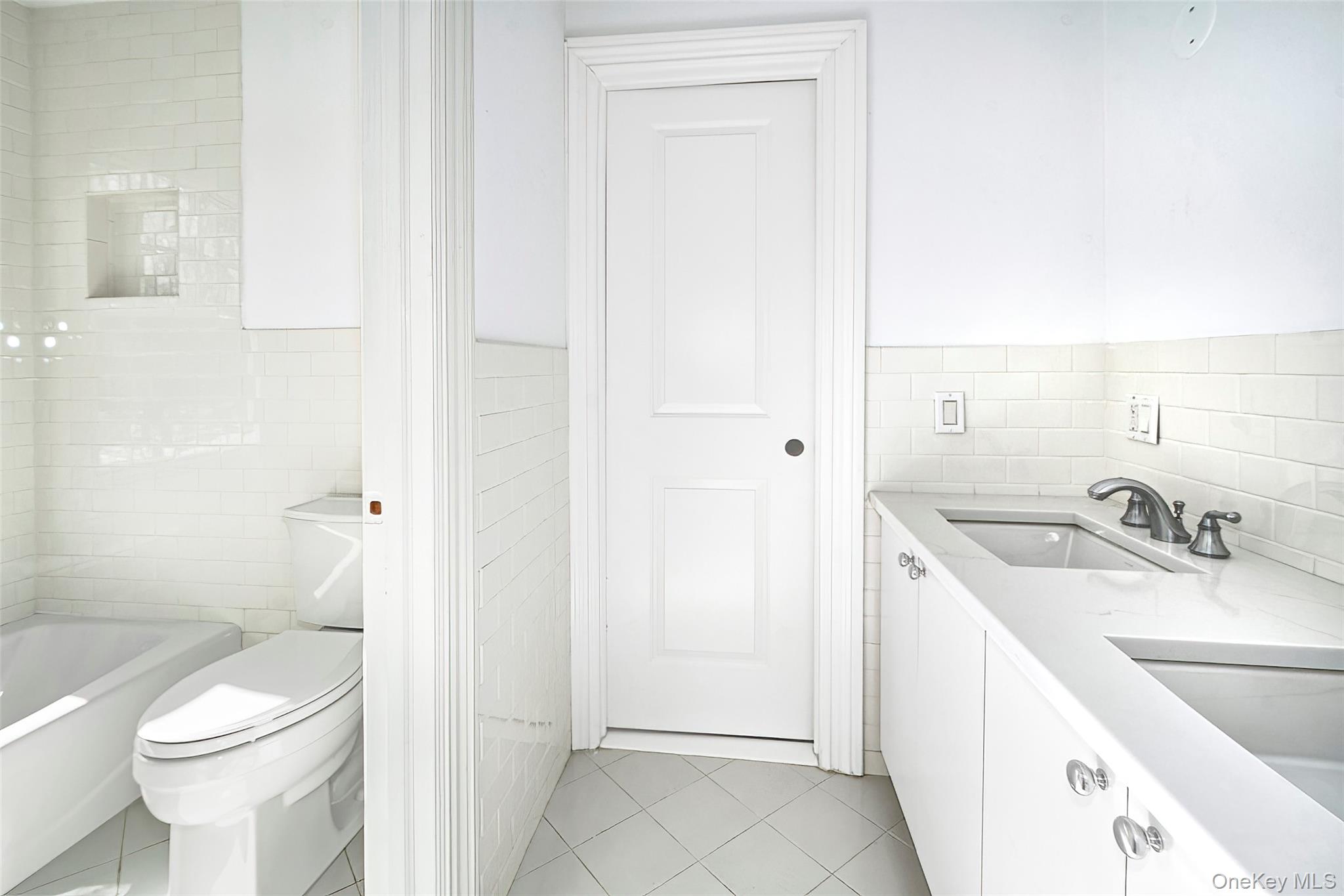 8 Walden Lane Rye, NY 10580 - Photo 15 of 28 Family full bath with patterned tile flooring and double sinks