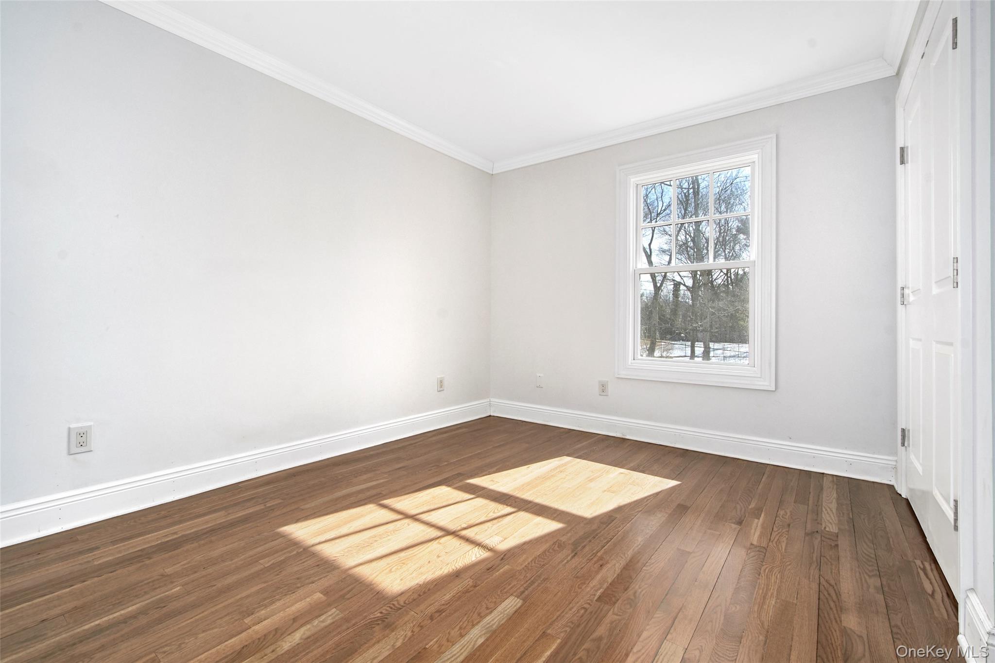 8 Walden Lane Rye, NY 10580 - Photo 16 of 28 Bedroom with ornamental molding, hardwood floors