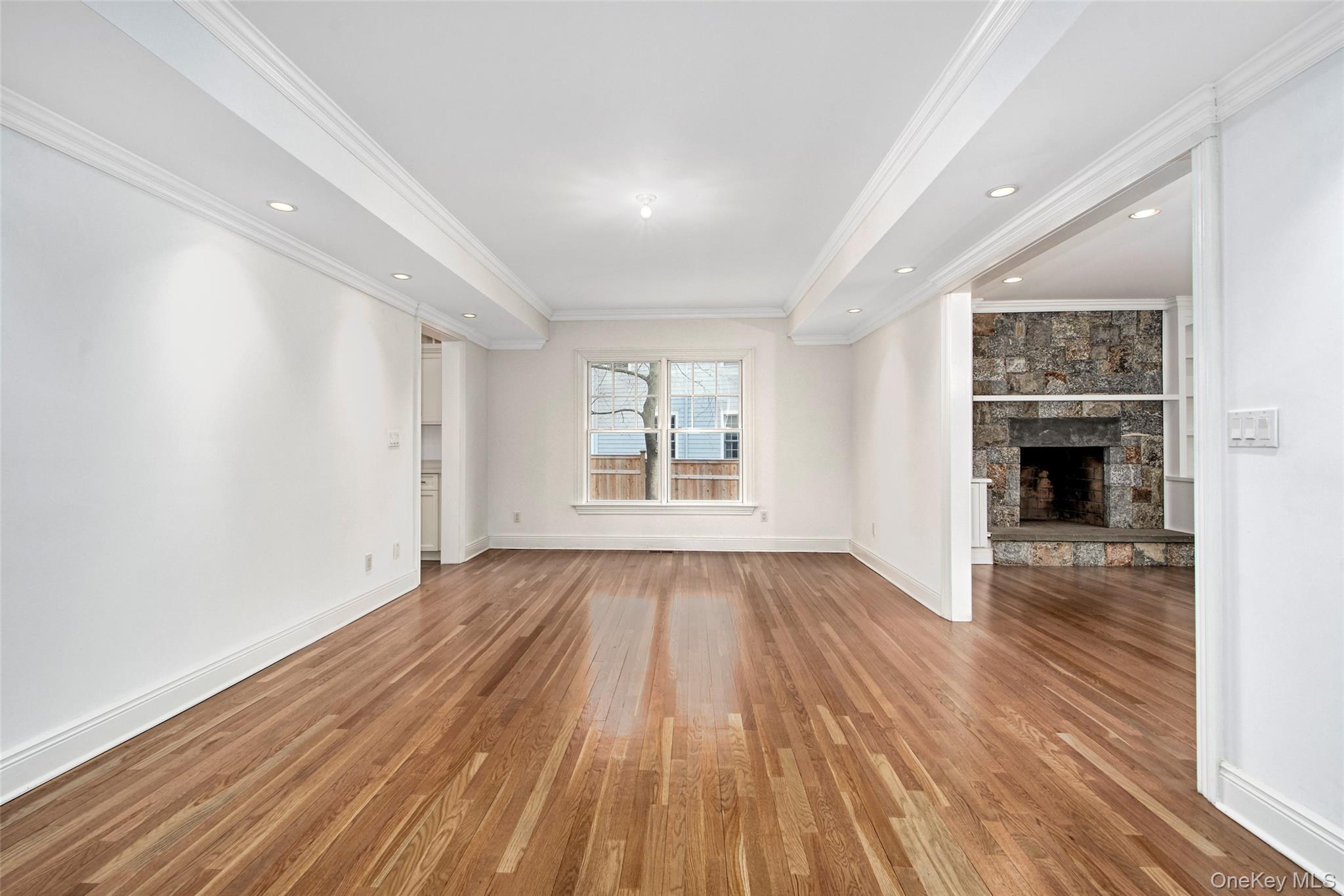8 Walden Lane Rye, NY 10580 - Photo 3 of 28 Formal dining room with recessed lighting, hardwood floors, detailed moldings flows easily from the living room into the chefs kitchen perfect for family and holiday gatherings