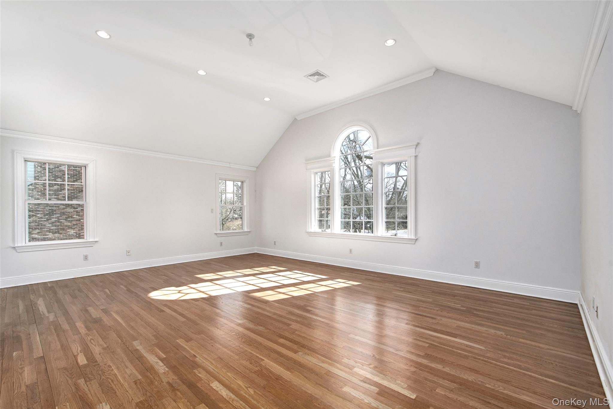 8 Walden Lane Rye, NY 10580 - Photo 10 of 28 Private Primary Suite offers hardwood floors, separate en suite bath, plenty of closets, architectural windows. A private retreat.