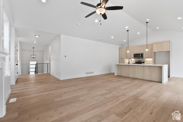 5364 Murray Rdg Road, Unit 122 Murray, UT 84123 - Photo 1 of 1 Unfurnished living room with light wood-type flooring, ceiling fan, recessed lighting, and high vaulted ceiling