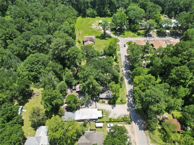 an aerial view of residential houses with city view