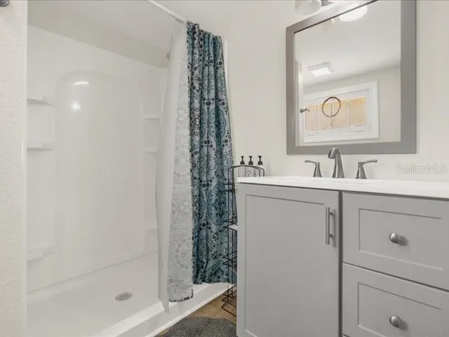 a bathroom with a sink and a mirror