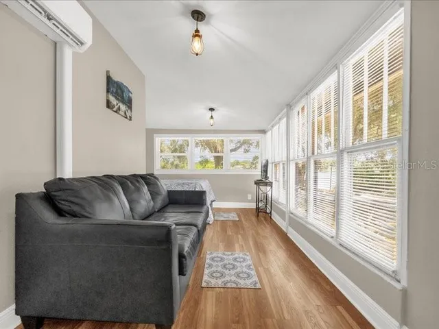 a living room with furniture and a large window