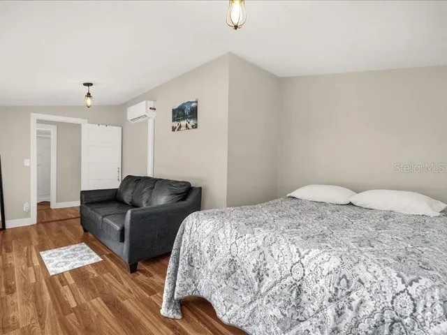 a bed room with a bed and a couch