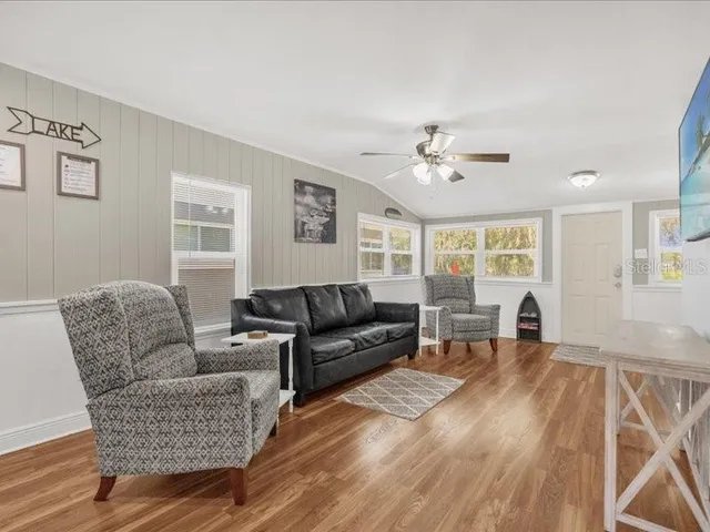 a living room with furniture and a window