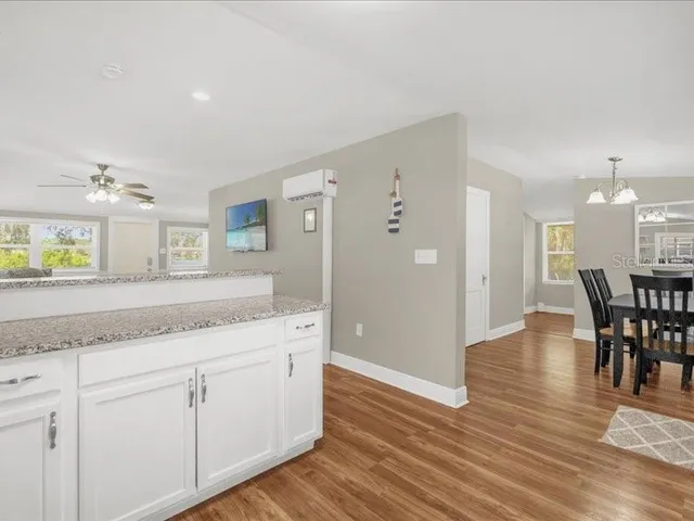 a kitchen with granite countertop white cabinets and a granite counter tops