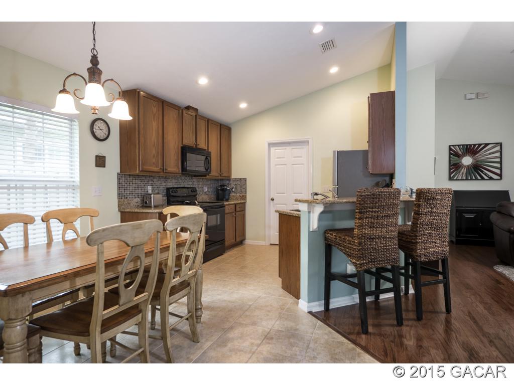 7491 Southwest 86th Way Gainesville, FL 32608 - Photo 4 of 23 New Tile in Kitchen/DR