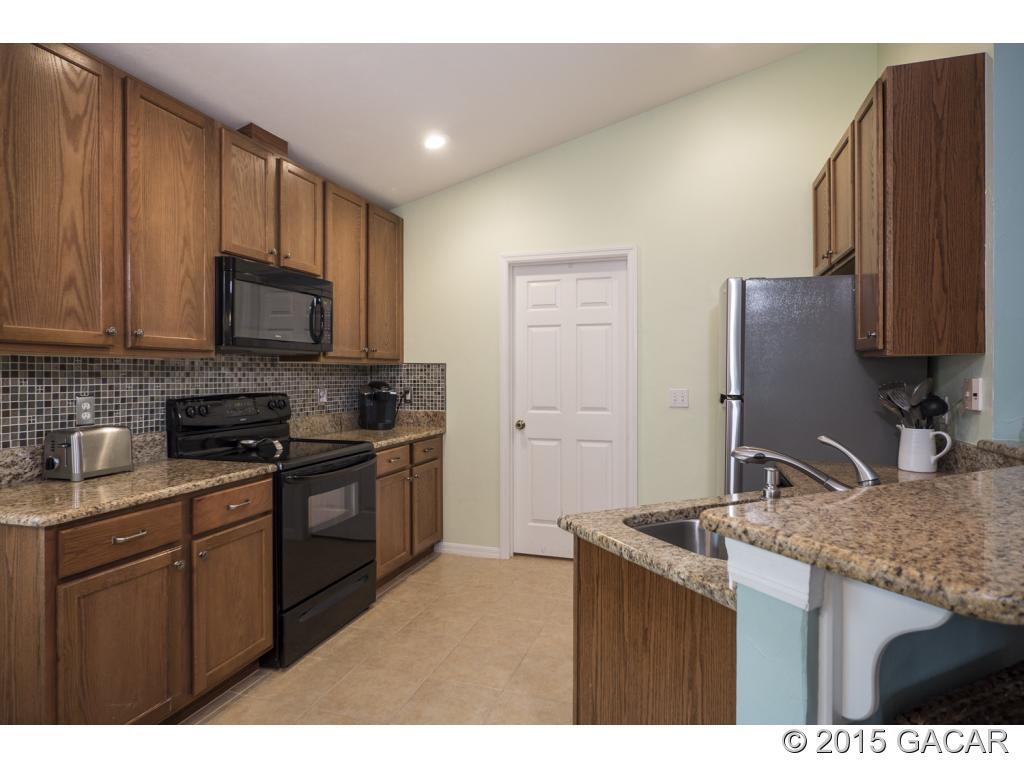 7491 Southwest 86th Way Gainesville, FL 32608 - Photo 5 of 23 New GRANITE in Kitchen