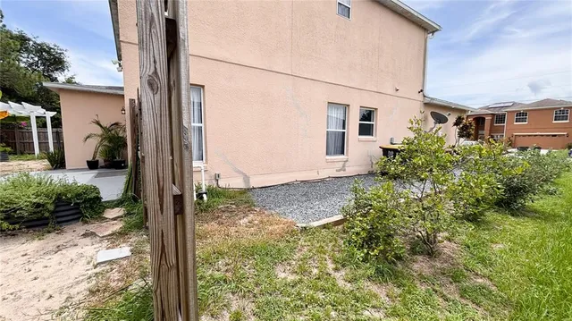 a view of a house with a tree