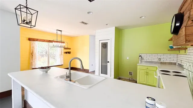 a bathroom with a sink a mirror and a shower
