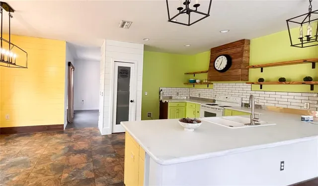 a room with a sink and a mirror