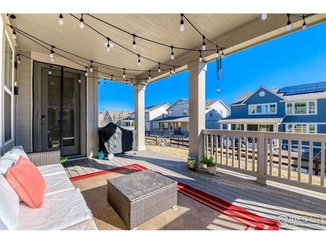 a living room with furniture a rug and a chandelier