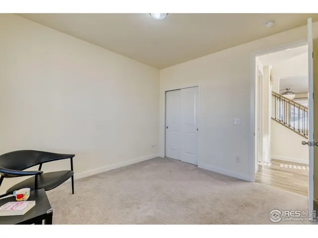 a view of an empty room and wooden floor