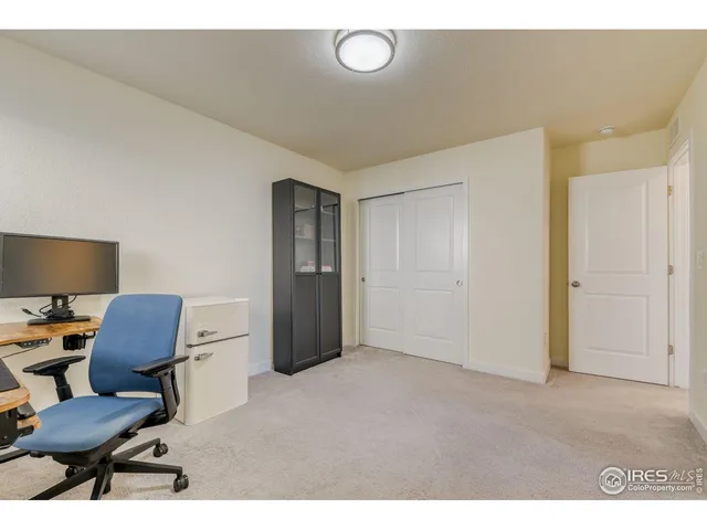 a view of work space with furniture and a window