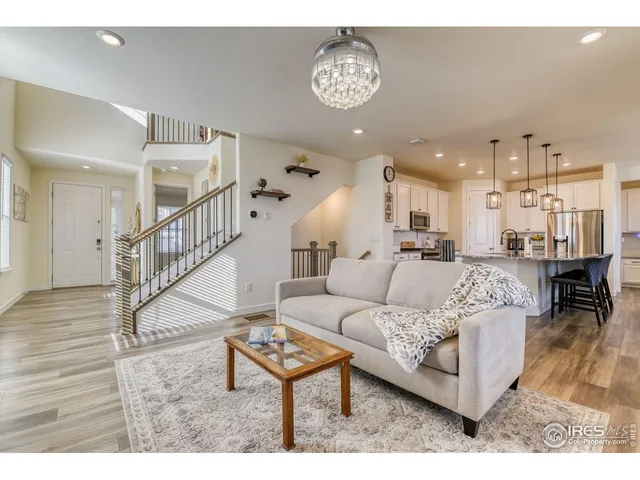 a living room with furniture and a table