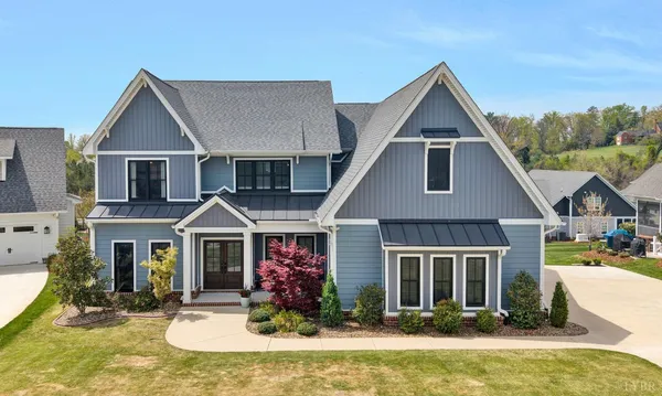 a front view of a house with yard