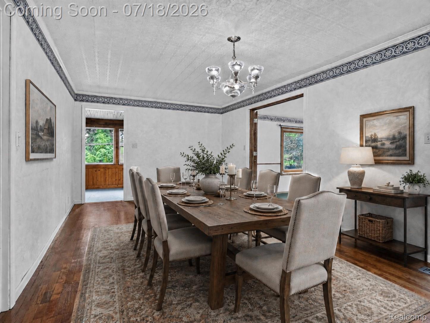 1437 East Cook Road Grand Blanc, MI 48439 - Photo 32 of 69 Formal dining space featuring wood-finish flooring, a decorative border, and a ceiling-mounted light fixture