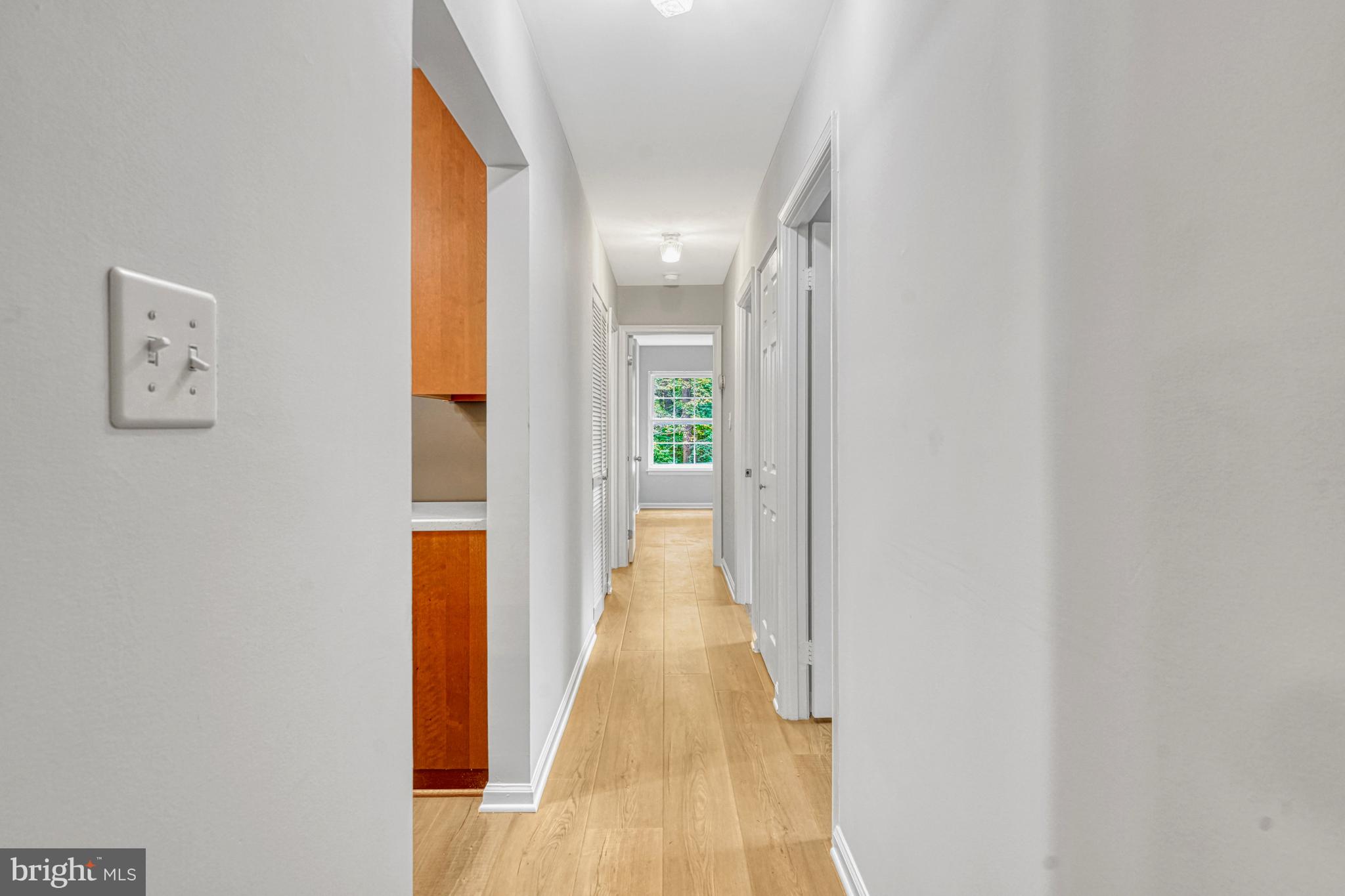 5815 Cove Landing Road, Unit 204 Burke, VA 22015 - Photo 11 of 39 primary bed at end of hall