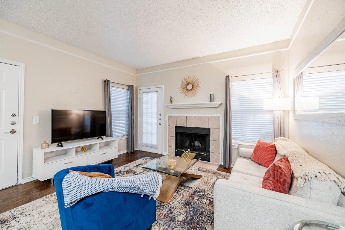 11908 Anderson Mill Road, Unit 732 Austin, TX 78726 - Photo 10 of 23 a living room with furniture and a flat screen tv