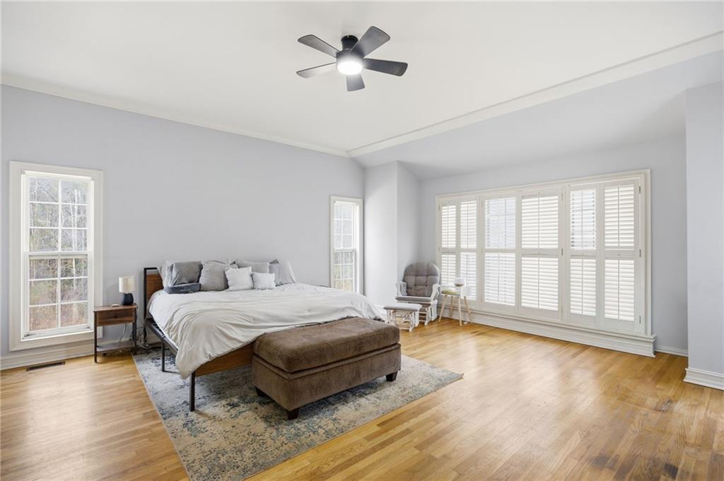 7387 Milam Road Winston, GA 30187 - Photo 24 of 41 a bedroom with a bed chandelier and a window