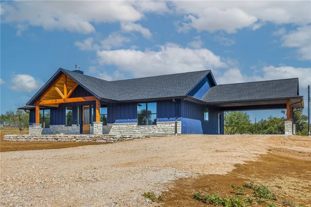 a view of a house with a snow in the yard