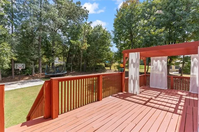 a view of balcony with wooden floor and outdoor seating