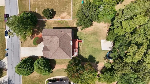 an aerial view of a house with a yard and a garden