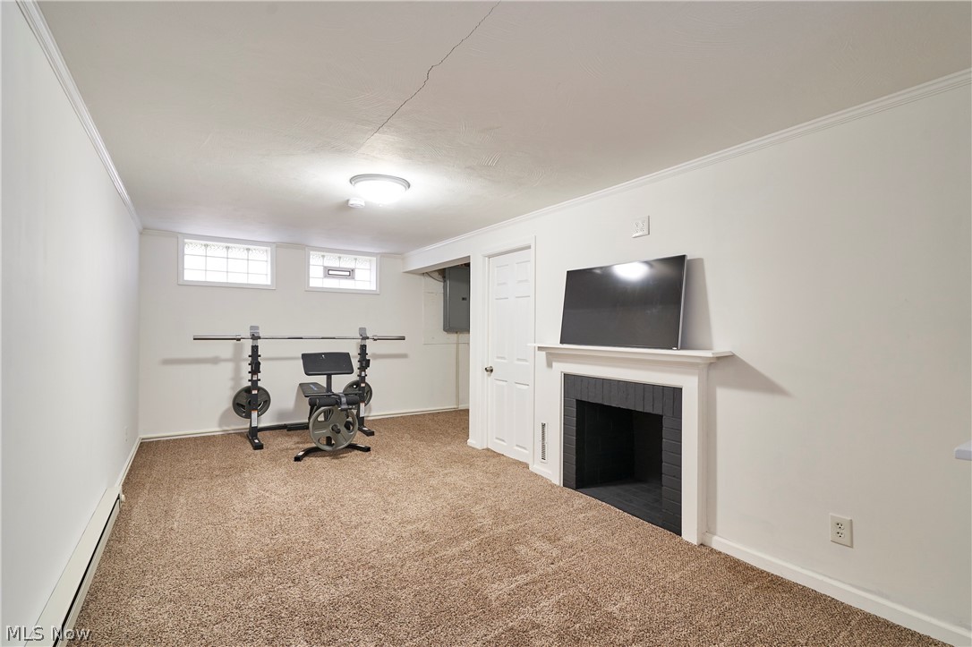 5215 Mayview Road Lyndhurst, OH 44124 - Photo 18 of 27 Rec room with carpet and a fireplace.