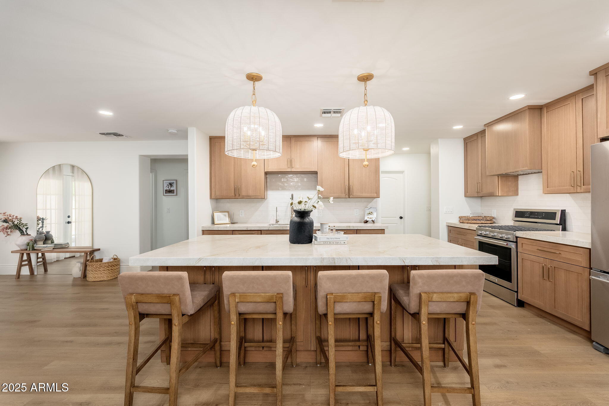 4030 East Fairmount Avenue Phoenix, AZ 85018 - Photo 1 of 23 a kitchen with kitchen island granite countertop a table and chairs in it