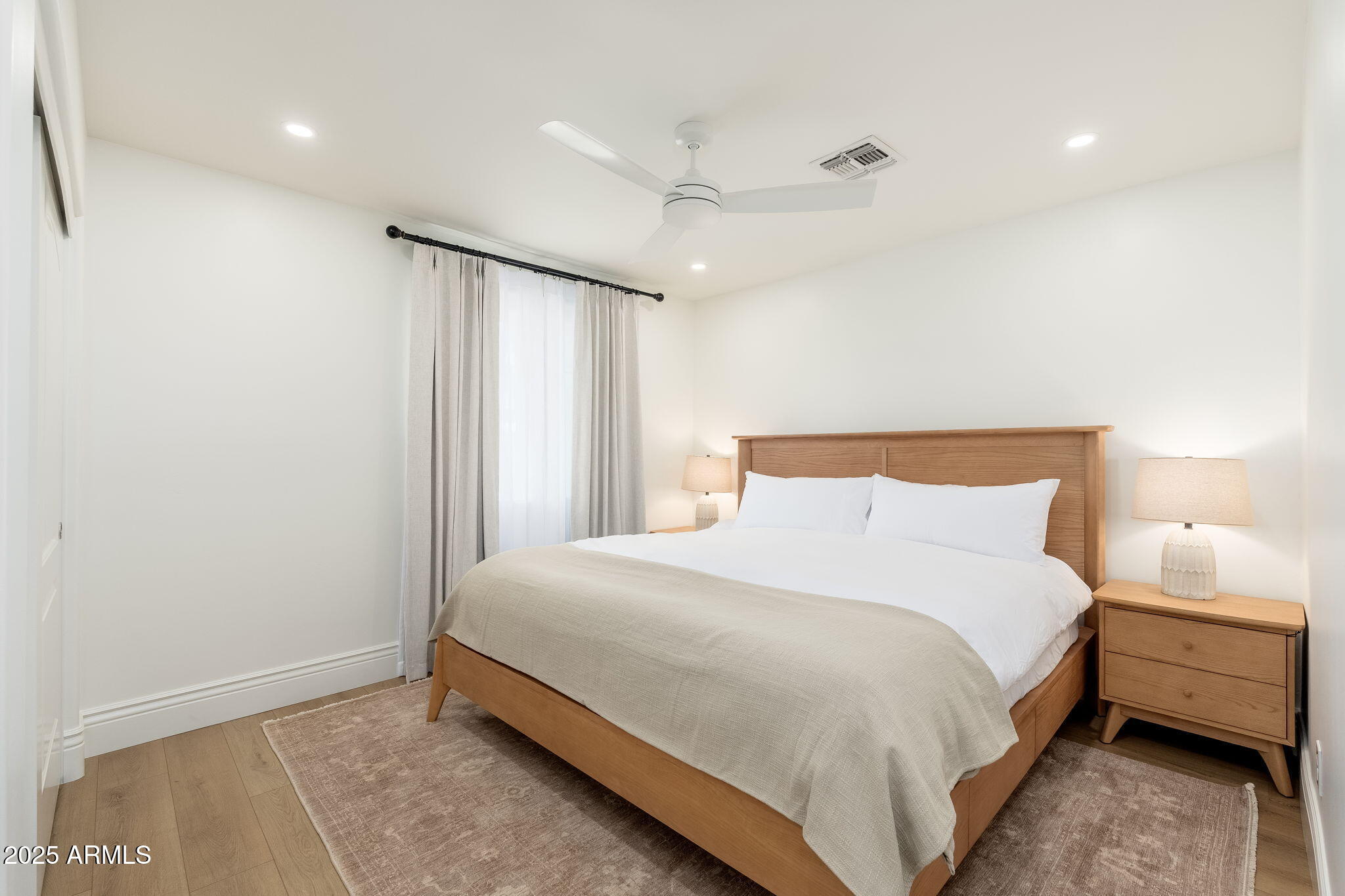 4030 East Fairmount Avenue Phoenix, AZ 85018 - Photo 12 of 23 a bedroom with a bed and a night stand