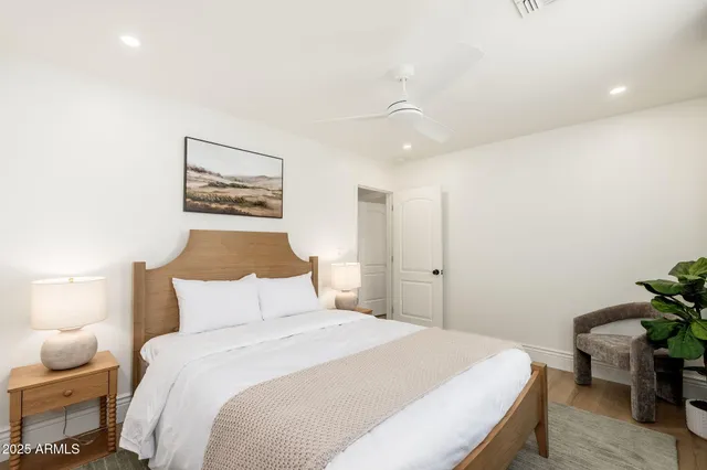 a bedroom with a bed and a table